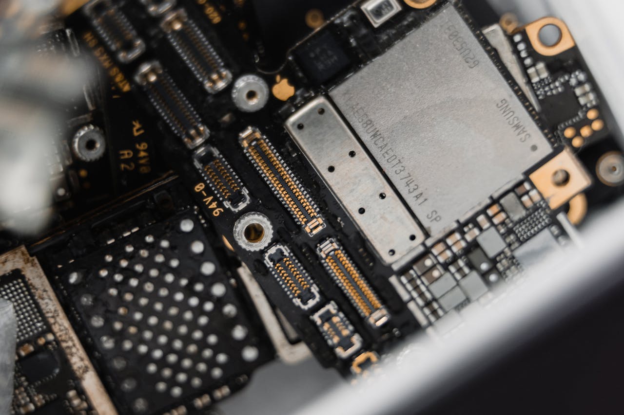 who-we-are Detailed view of electronic components on a circuit board for maintenance.